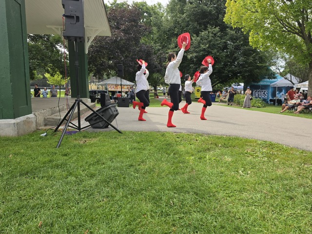 Dance showcase with red hats and boots